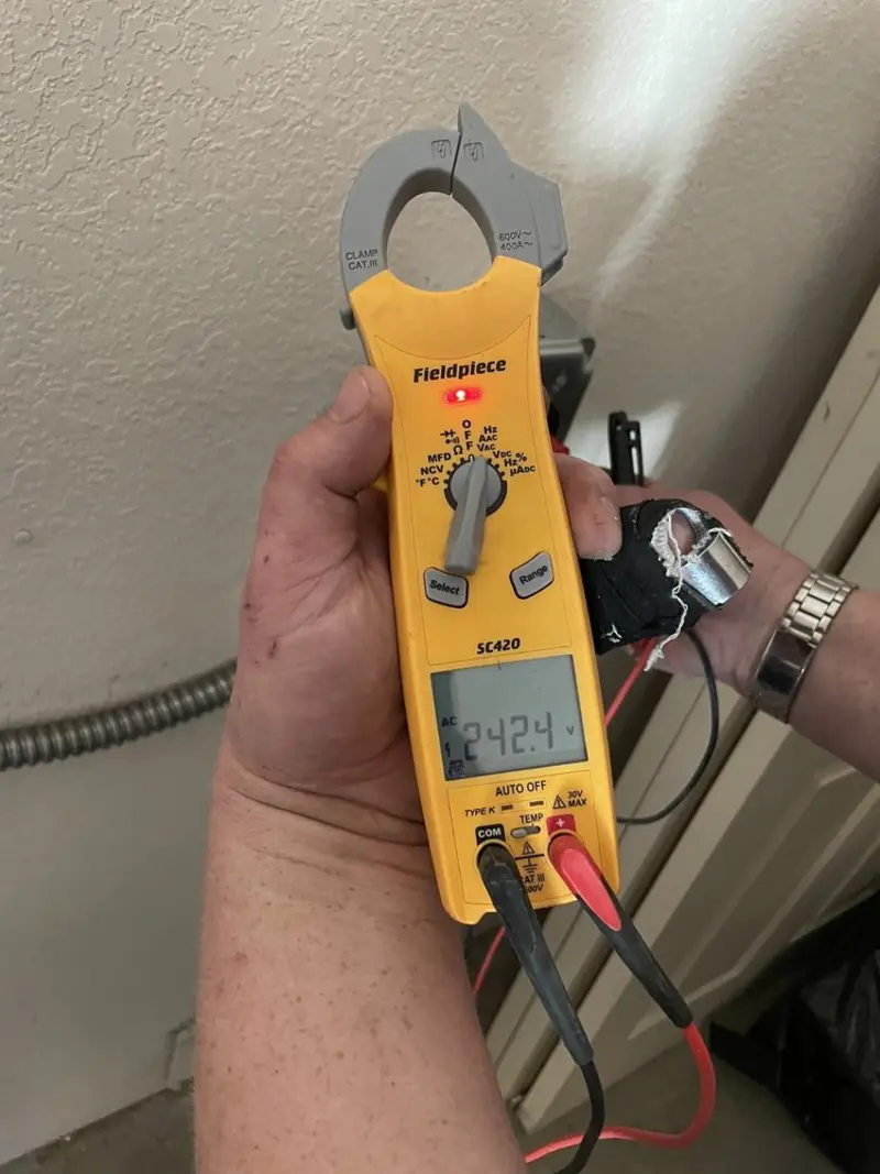 Voltage testing with clamp meter during Circuit Breaker Repair in New Rochelle
